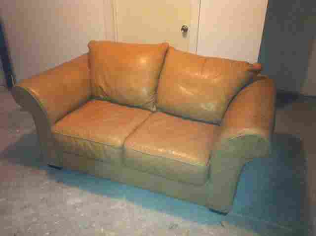 tan leather couch and love seat for $225
