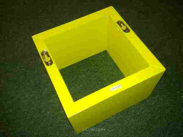 A small yellow cube-shaped shelf