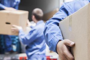 Three men big muscles movers provide local moving service at Surrey